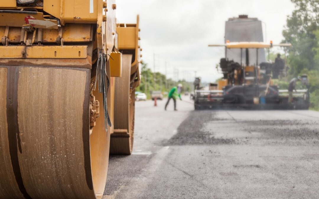 Road Construction with a shot of the roller and crew working