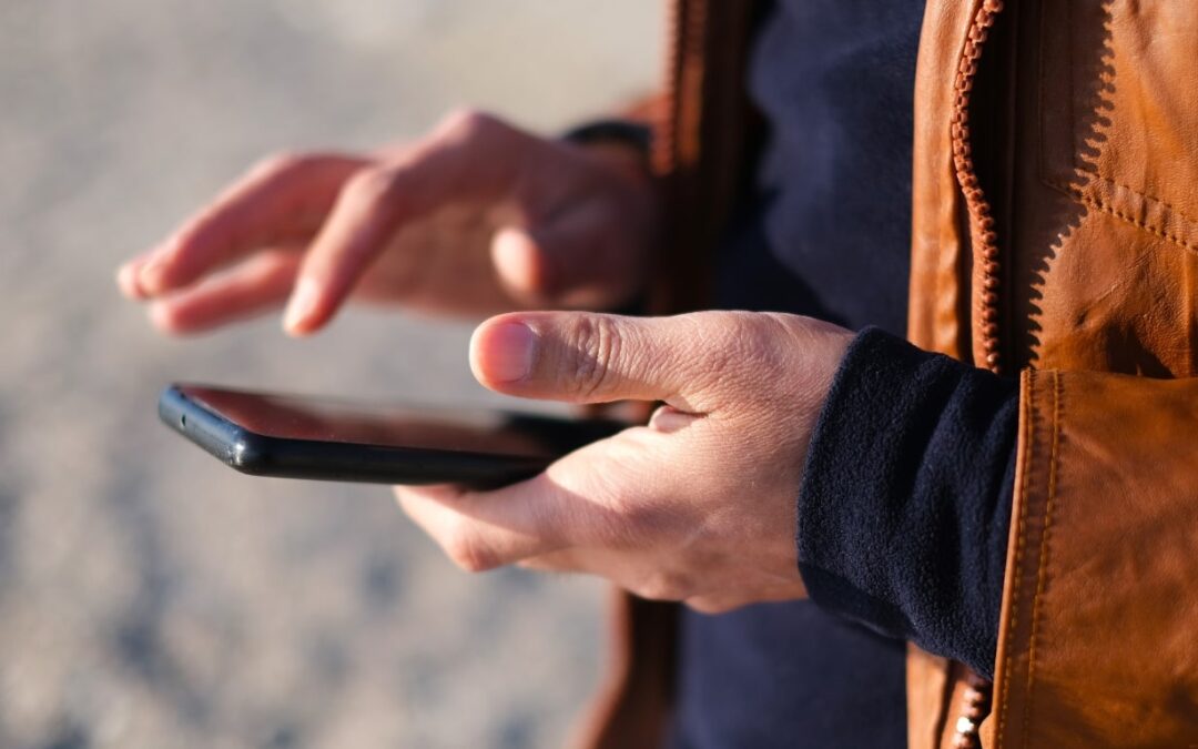 Man on His Phone Checking Out Types Of Stone