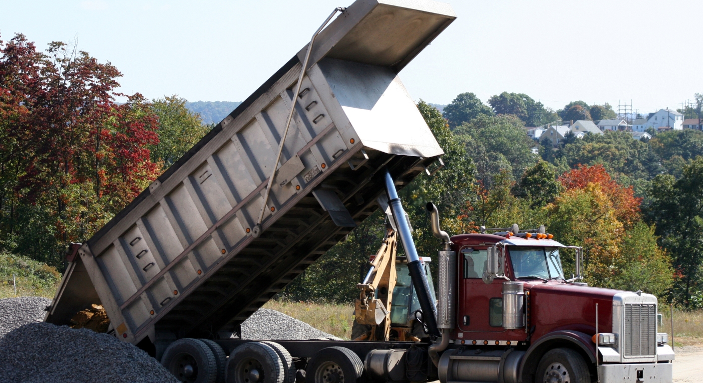 dump truck delivering aggregate