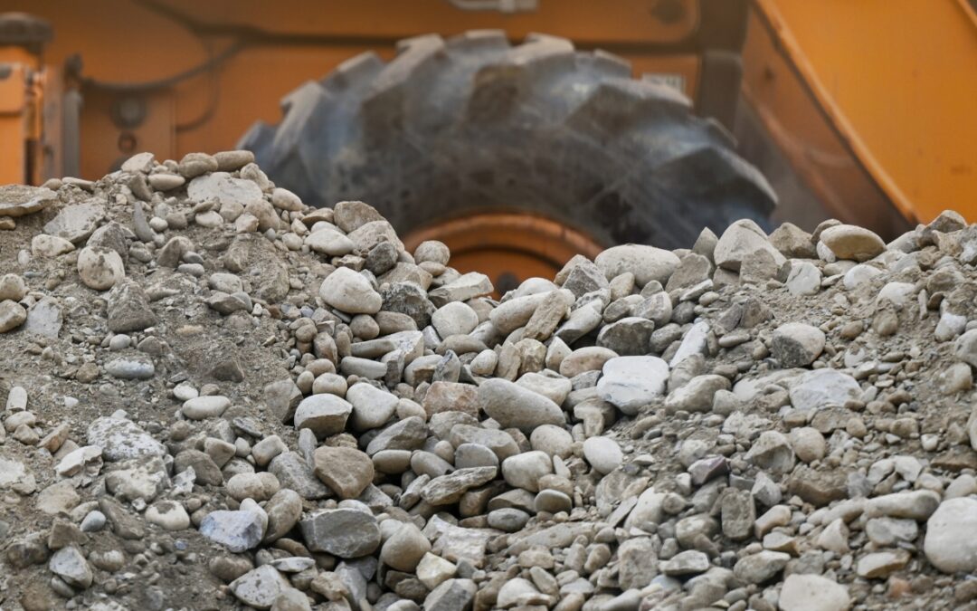 rock along side of a construction truck